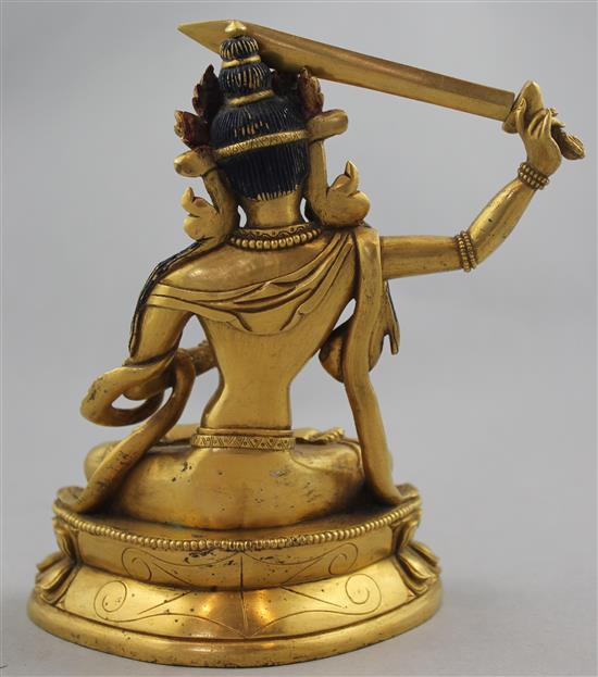 A Sino-Tibetan gilt bronze seated figure of Manjushri, 19cm